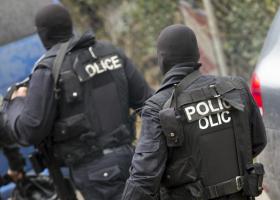 Two arrested as police raid property after 'cash and drugs seized'